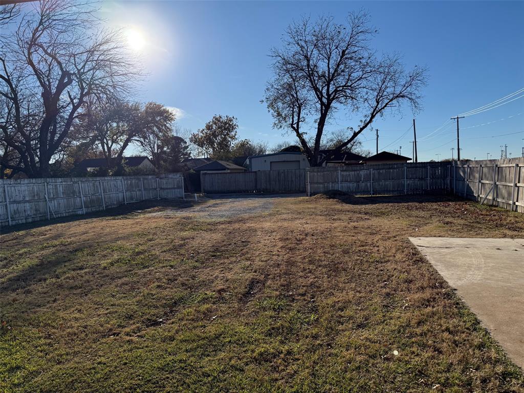 1826 North Woods Street Sherman, TX 75092 - Photo 26 of 29 a view of yard with wooden fence