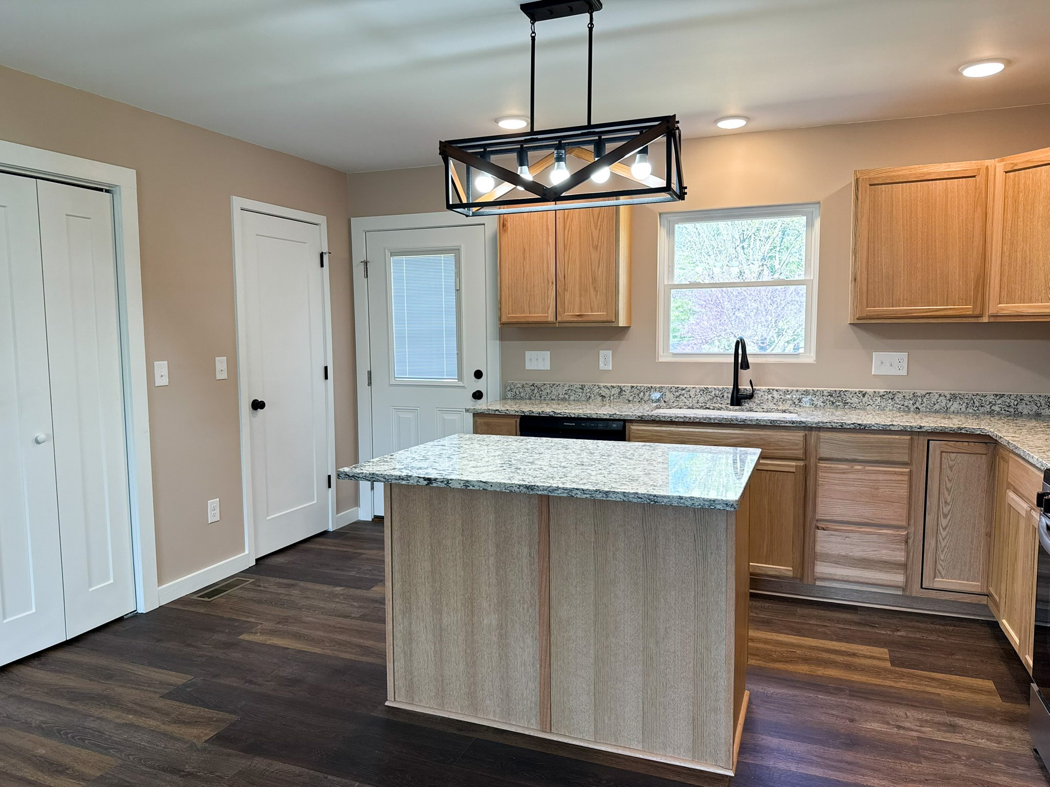 44 Blue Lake Road McMinnville, TN 37110 - Photo 16 of 30 a kitchen with granite countertop a sink cabinets and window