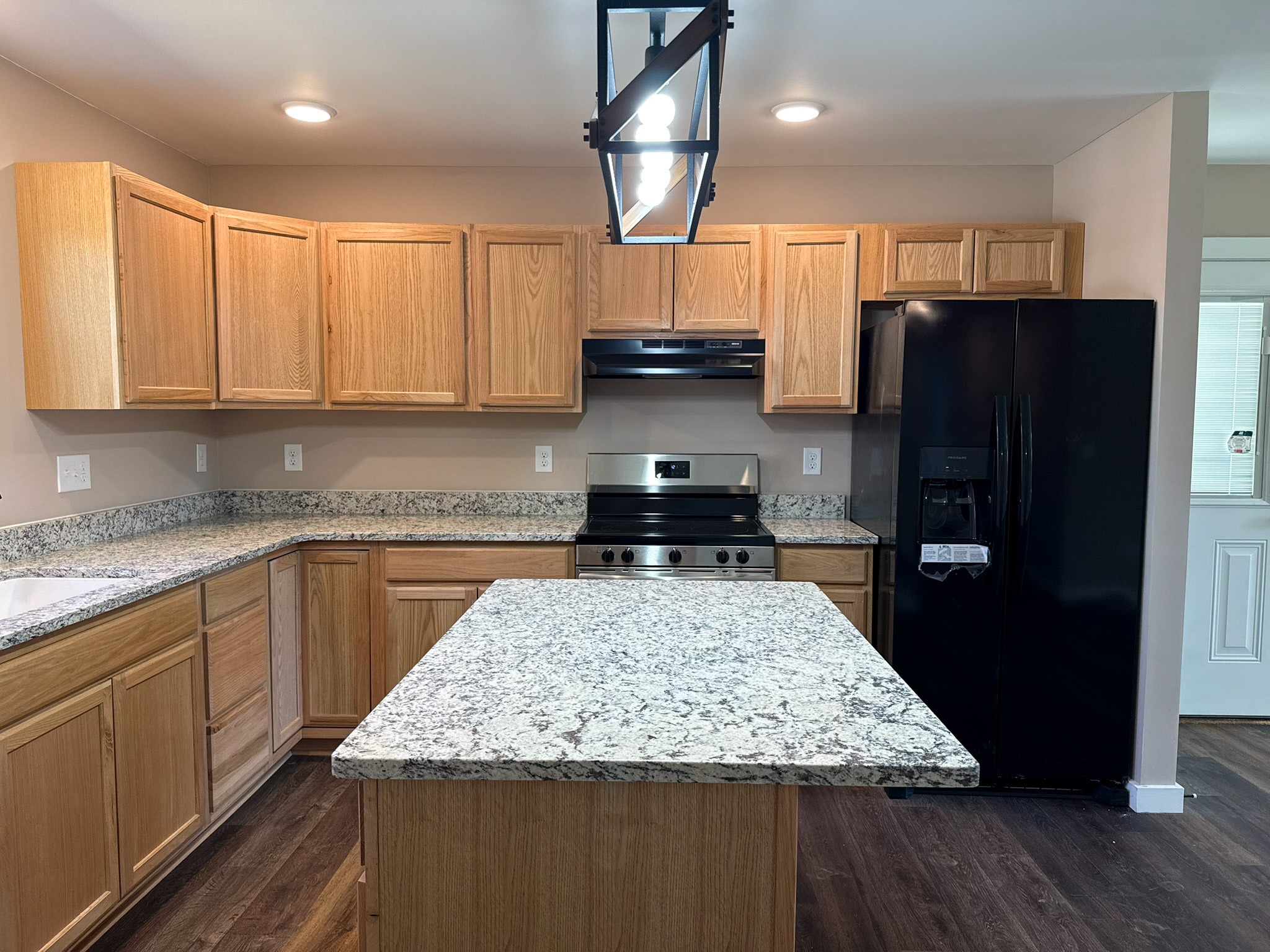 44 Blue Lake Road McMinnville, TN 37110 - Photo 18 of 30 a kitchen with stainless steel appliances granite countertop a refrigerator a stove a sink and a microwave