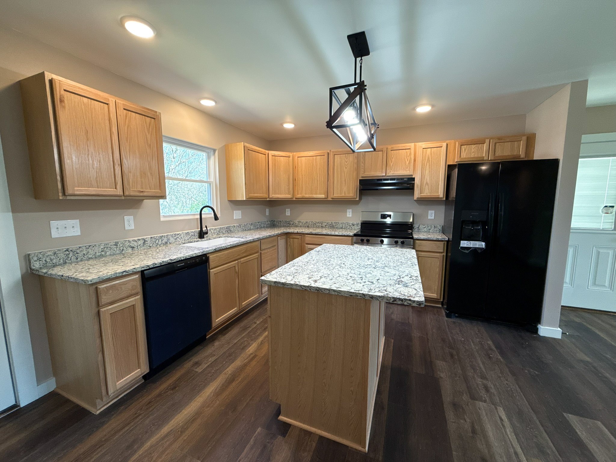 44 Blue Lake Road McMinnville, TN 37110 - Photo 19 of 30 a kitchen with a refrigerator a sink and wooden floor
