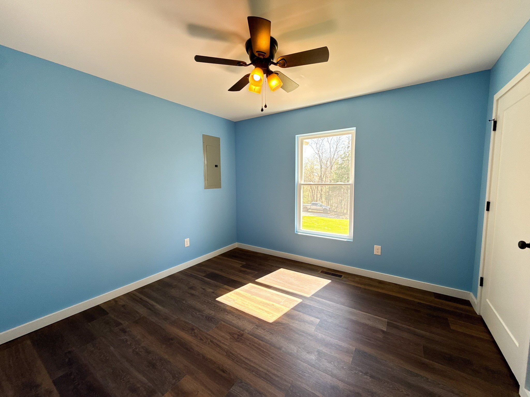 44 Blue Lake Road McMinnville, TN 37110 - Photo 22 of 30 a view of empty room with wooden floor and fan