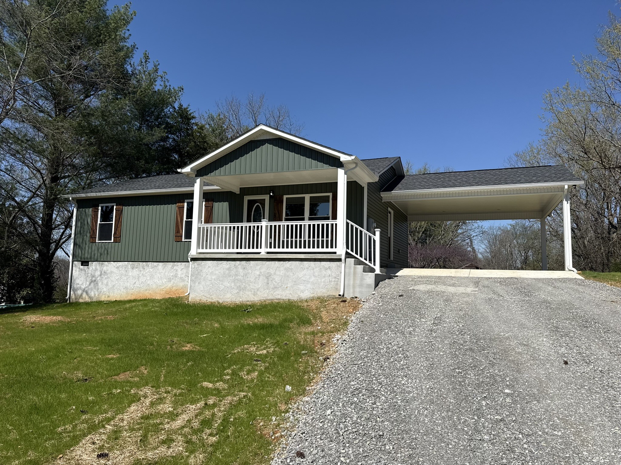 44 Blue Lake Road McMinnville, TN 37110 - Photo 5 of 30 a front view of a house with a yard and garage