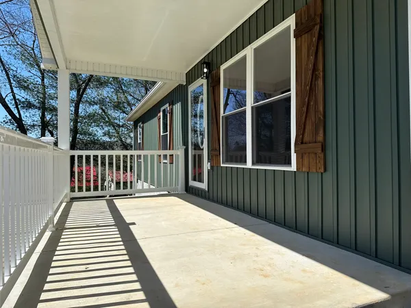 a balcony view with a wooden floor