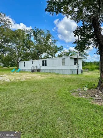 a view of a house with a big yard