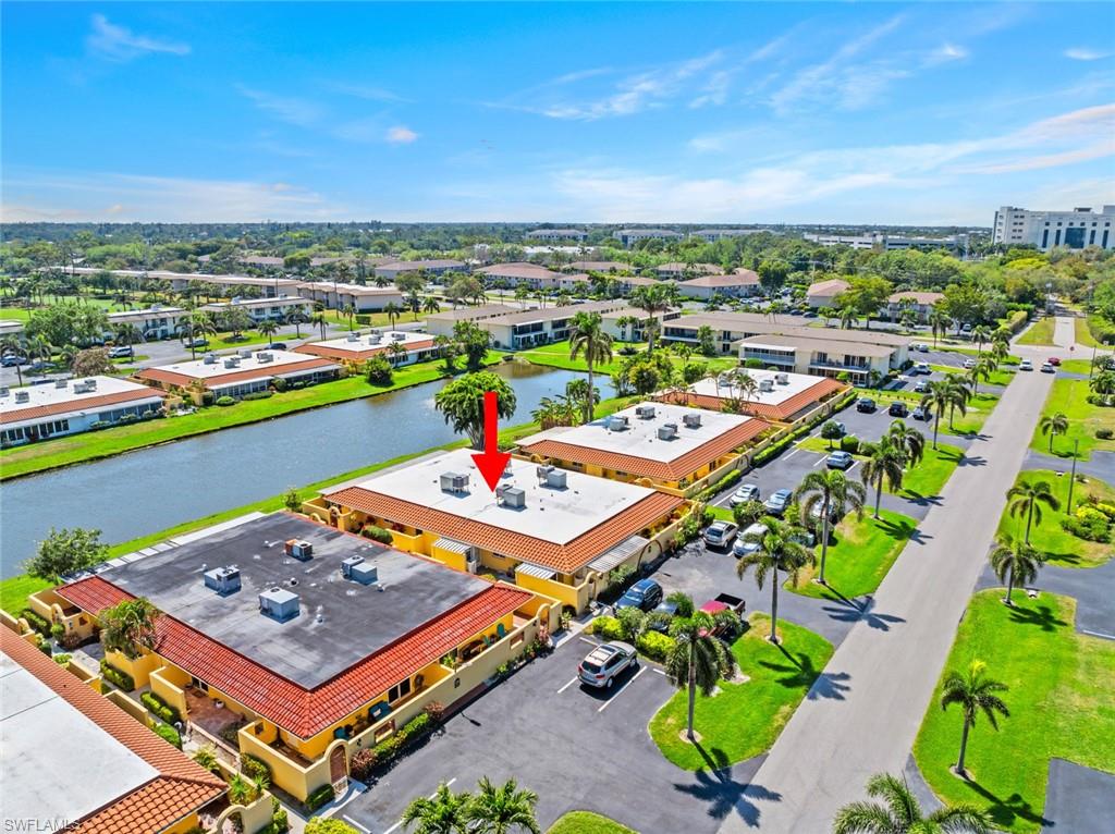 126 Harrison Road, Unit M3 Naples, FL 34112 - Photo 45 of 48 Drone / aerial view with a water view