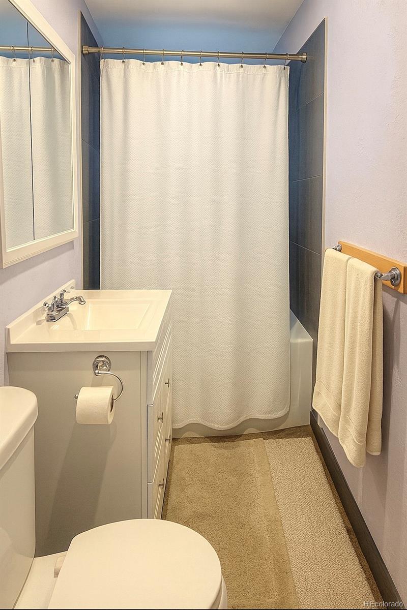 2355 Ames Street Edgewater, CO 80214 - Photo 13 of 29 a bathroom with a sink toilet and shower