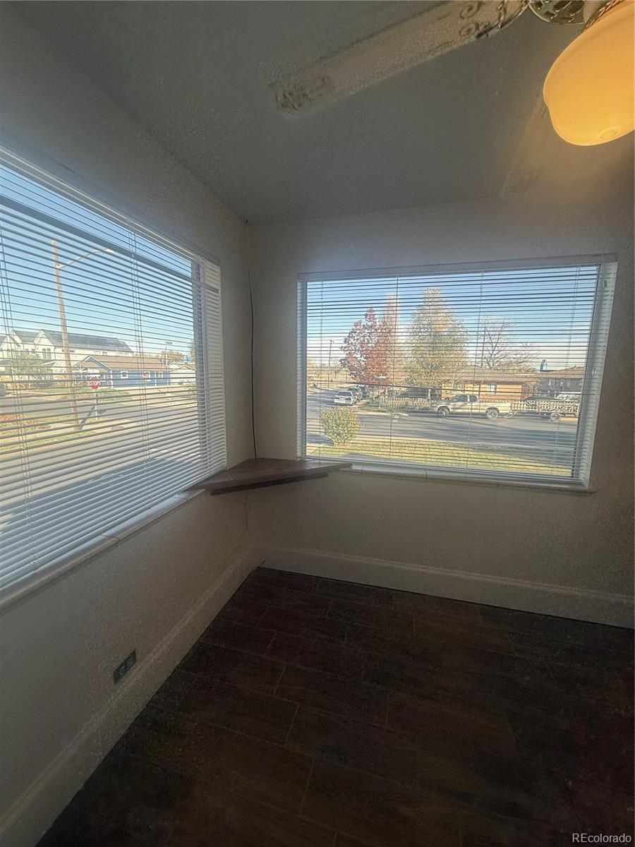 2355 Ames Street Edgewater, CO 80214 - Photo 24 of 29 a view of an empty room with wooden floor and a window