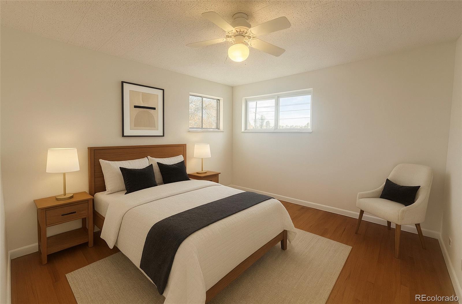 2355 Ames Street Edgewater, CO 80214 - Photo 6 of 29 a bedroom with a bed and a chandelier