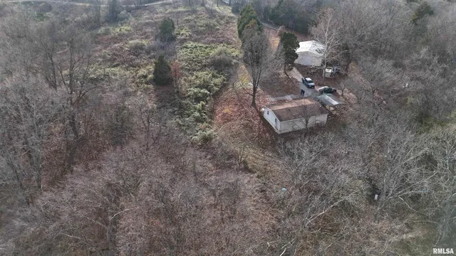 a backyard of a house with lots of green space and fog