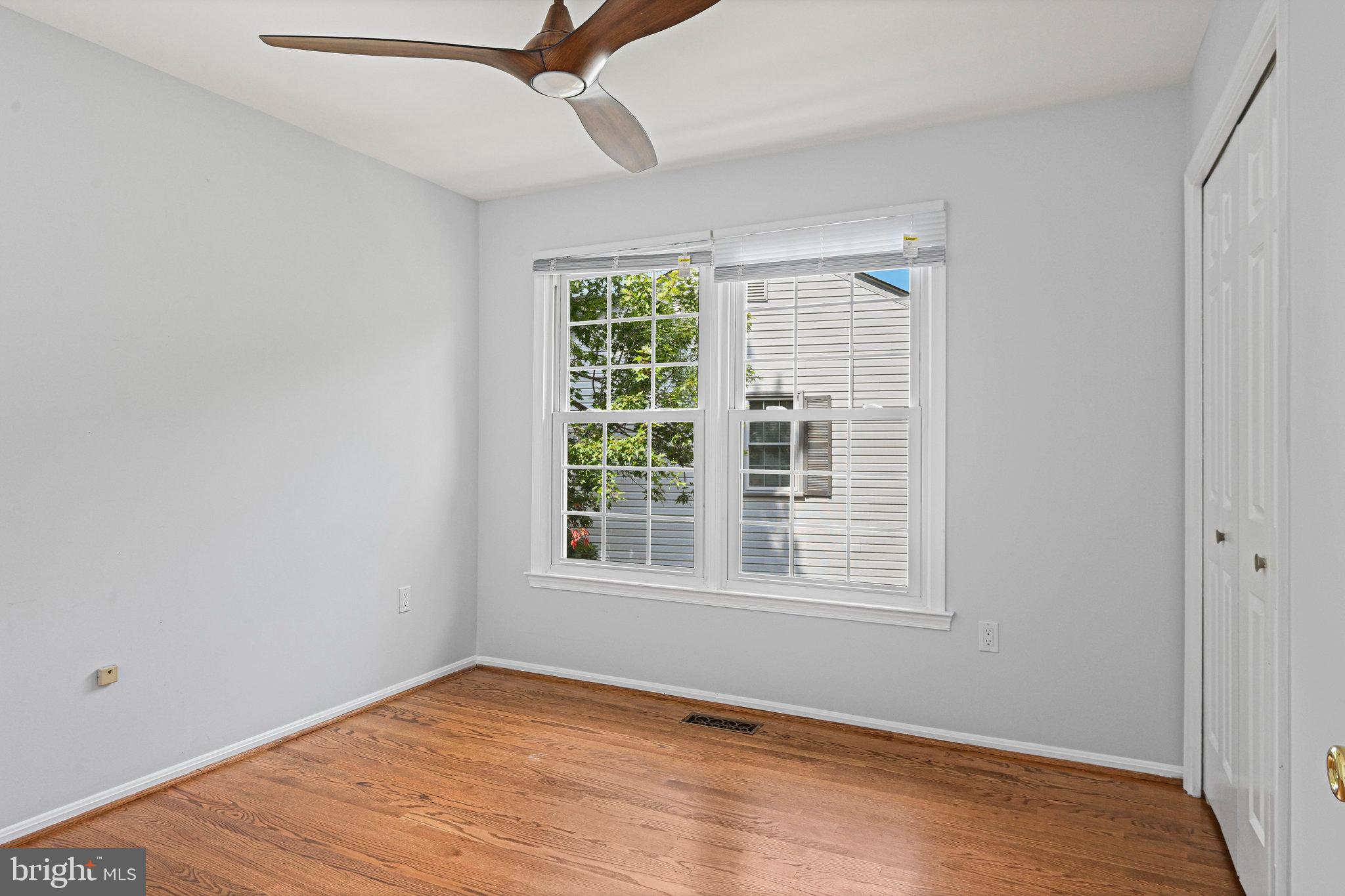 13345 Point Rider Lane Herndon, VA 20171 - Photo 35 of 43 a view of an empty room with wooden floor and a window