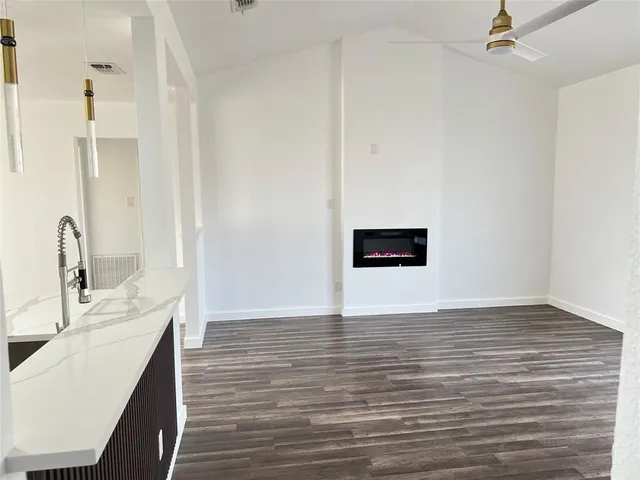 a view of a kitchen from the hallway