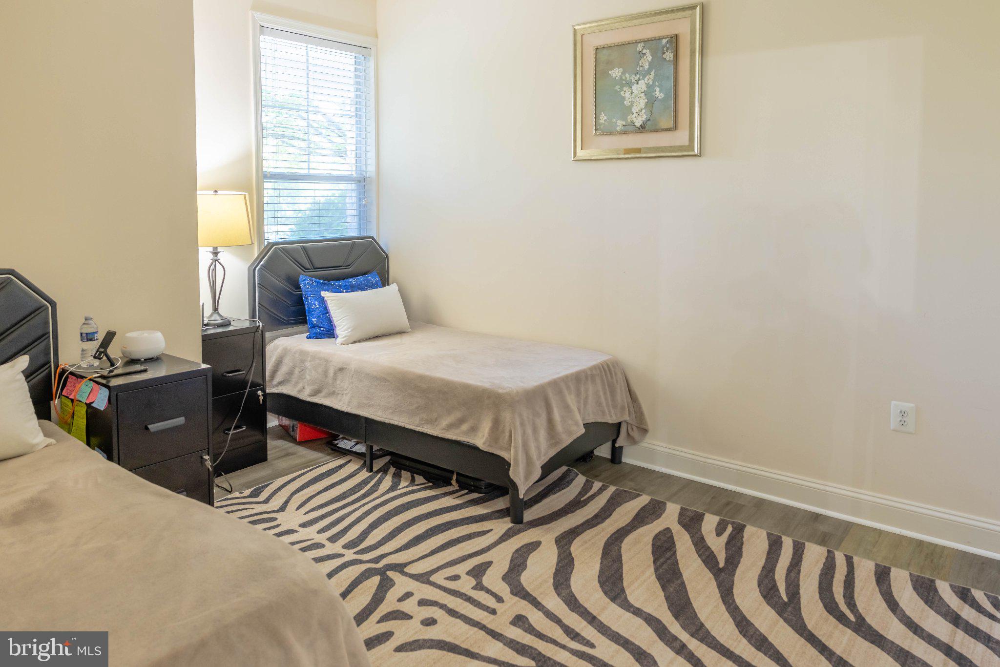 12824 Clarksburg Square Road, Unit 105 Clarksburg, MD 20871 - Photo 65 of 96 Cozy bedroom with modern accents.