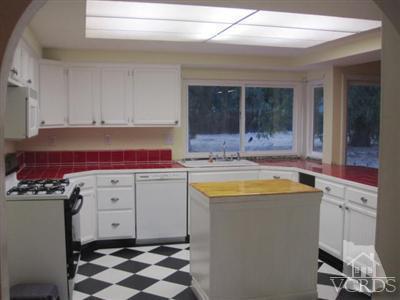 4347 Apricot Road Simi Valley, CA 93063 - Photo 14 of 19 a room with a stove a sink and a window