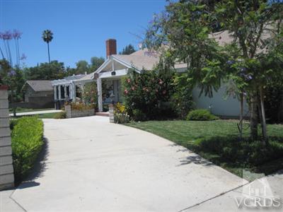 4347 Apricot Road Simi Valley, CA 93063 - Photo 3 of 19 a front view of a house with a yard and trees