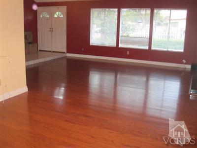 4347 Apricot Road Simi Valley, CA 93063 - Photo 7 of 19 a view of an empty room with wooden floor and a window