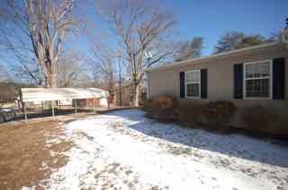 1580 Turner Branch Road Goodview, VA 24095 - Photo 4 of 19 a view of a house with a yard covered in snow