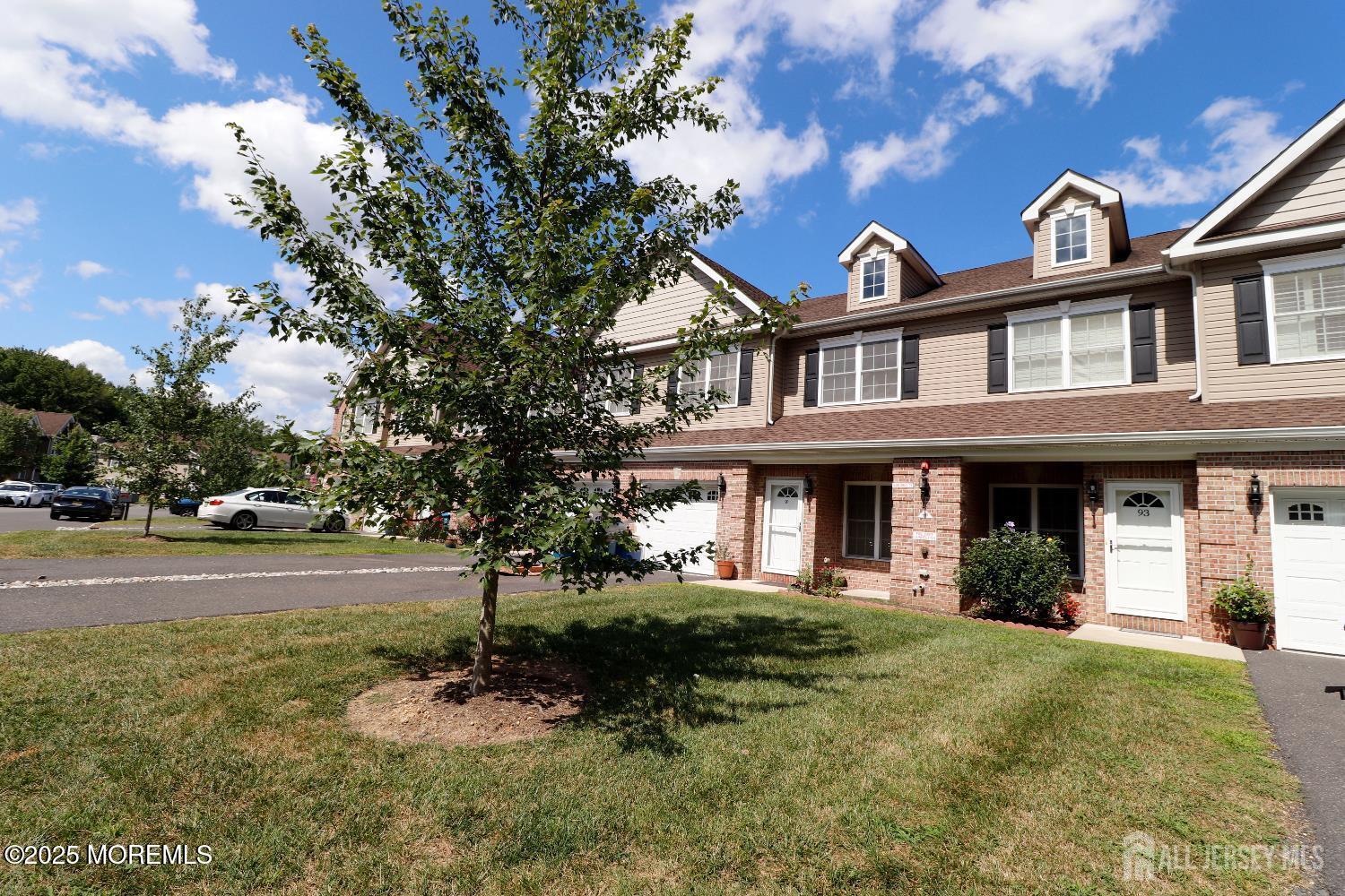 Undisclosed Address Monroe Township, NJ 08831 - Photo 2 of 10 a front view of a house with a yard