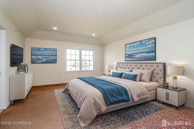 a bedroom with bed and a flat screen tv