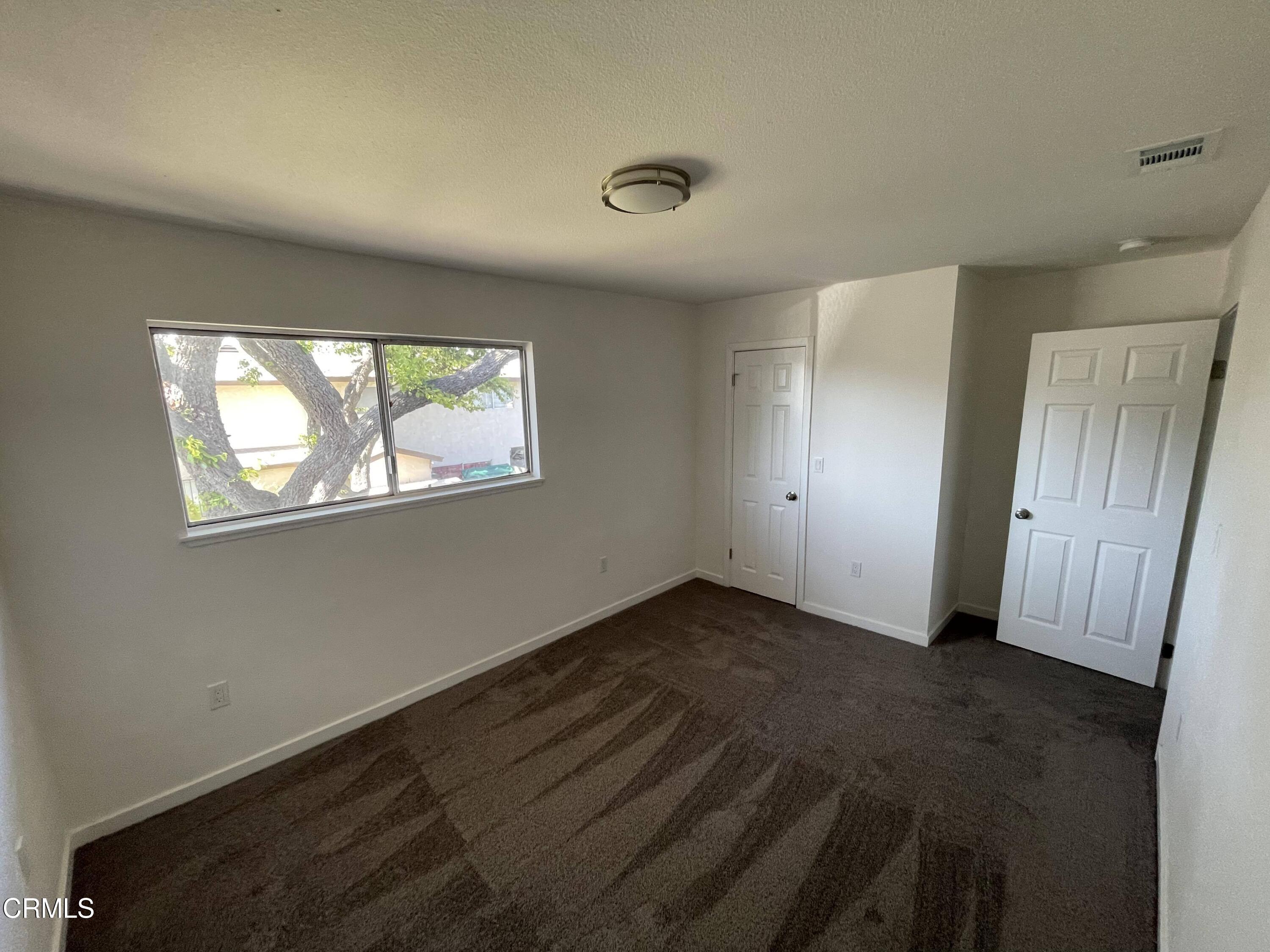 3042 Concord Drive, Unit 34 Oxnard, CA 93033 - Photo 7 of 8 an empty room with windows