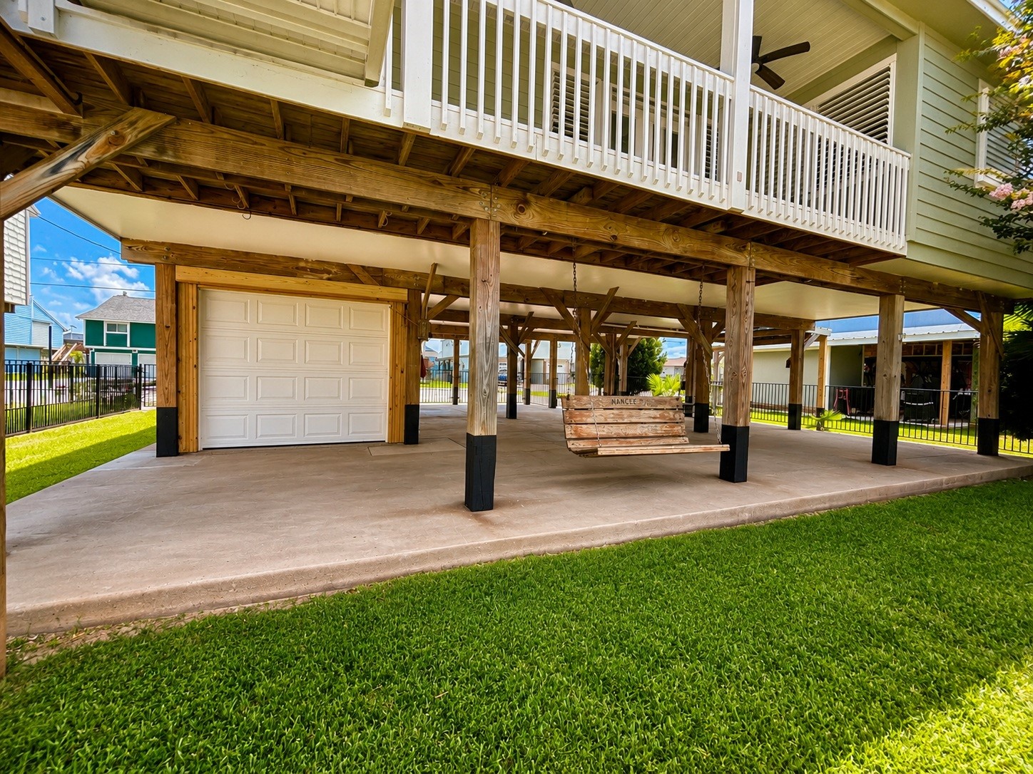 135 Sand Shoals Road Freeport, TX 77541 - Photo 7 of 20 Easy access to the lower level garage storage for toys, tools, golf cart and even has a workshop and electrical power.