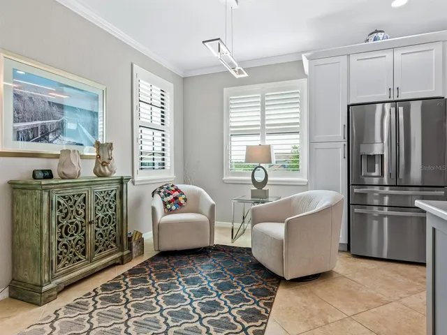 a bedroom with a bed couch and a window