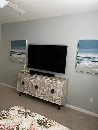 a living room with furniture window and wooden floor