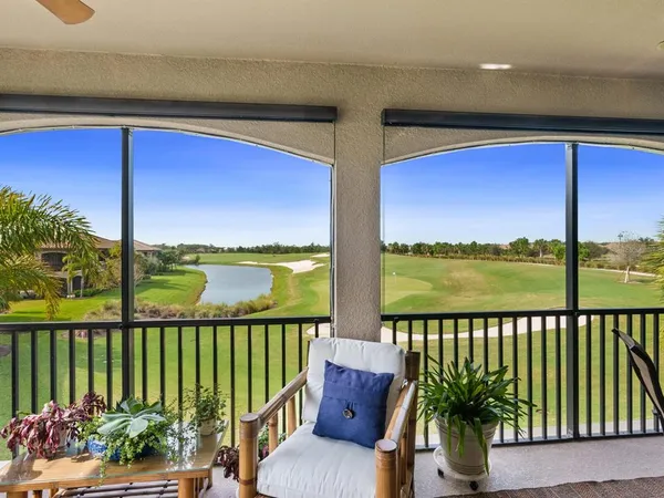 a view of a golf course with a lake