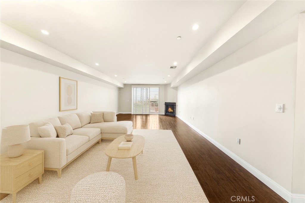 11218 Camarillo Street, Unit 404 Toluca Lake, CA 91602 - Photo 16 of 53 a living room with furniture and a large window