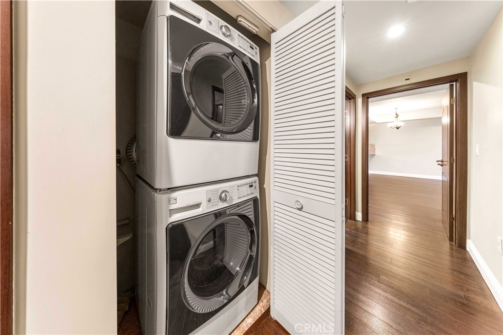 11218 Camarillo Street, Unit 404 Toluca Lake, CA 91602 - Photo 27 of 53 a view of a hallway with washer and dryer