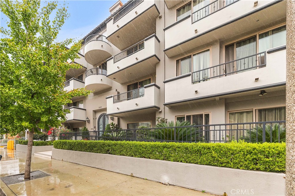 11218 Camarillo Street, Unit 404 Toluca Lake, CA 91602 - Photo 3 of 53 a view of a white building among the street