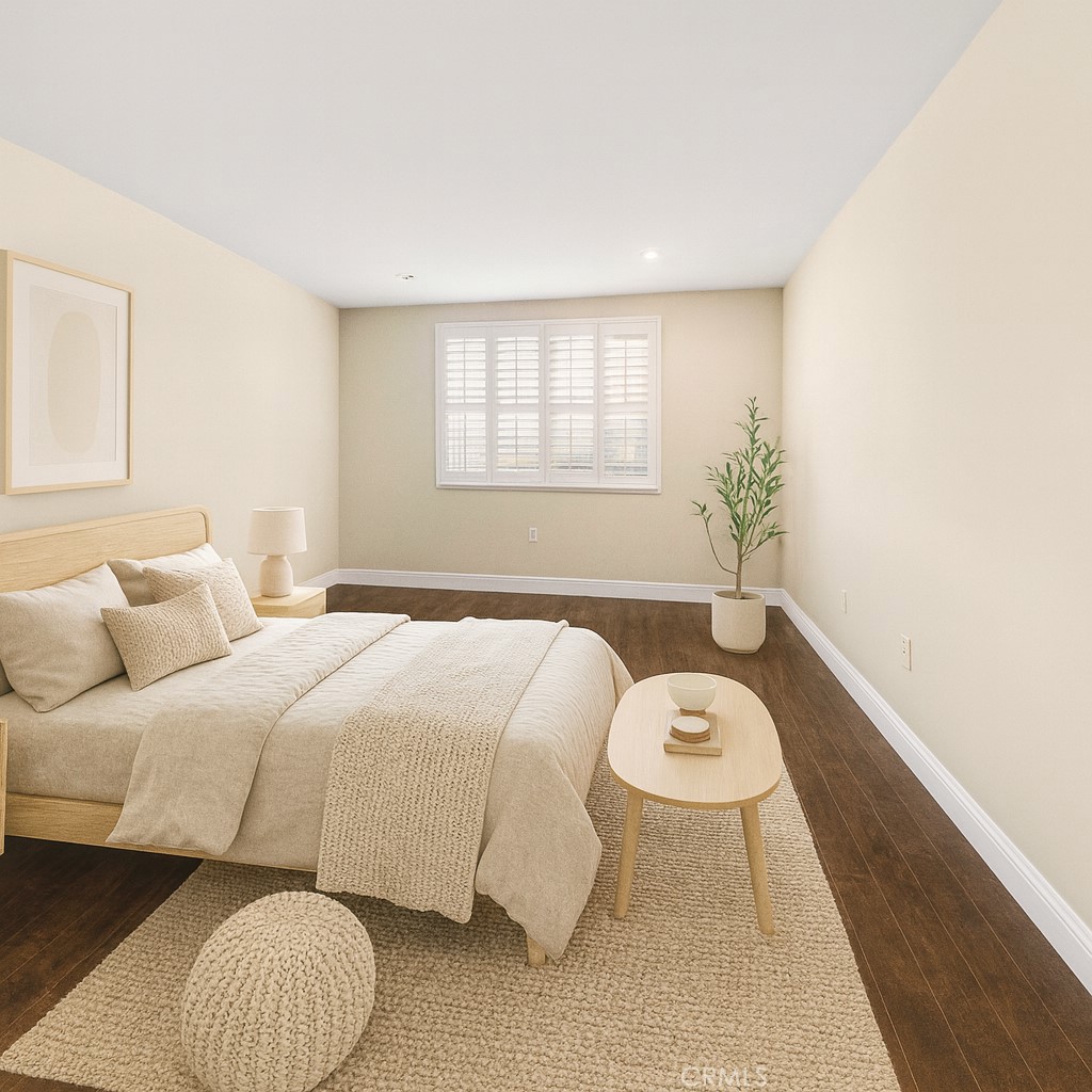 11218 Camarillo Street, Unit 404 Toluca Lake, CA 91602 - Photo 33 of 53 a bedroom with a bed and a window