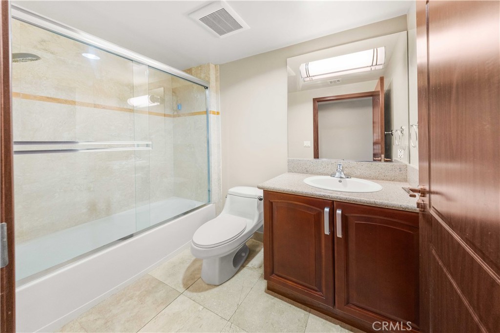 11218 Camarillo Street, Unit 404 Toluca Lake, CA 91602 - Photo 35 of 53 a bathroom with a sink and a mirror