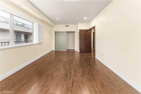 a view of hallway with wooden floor
