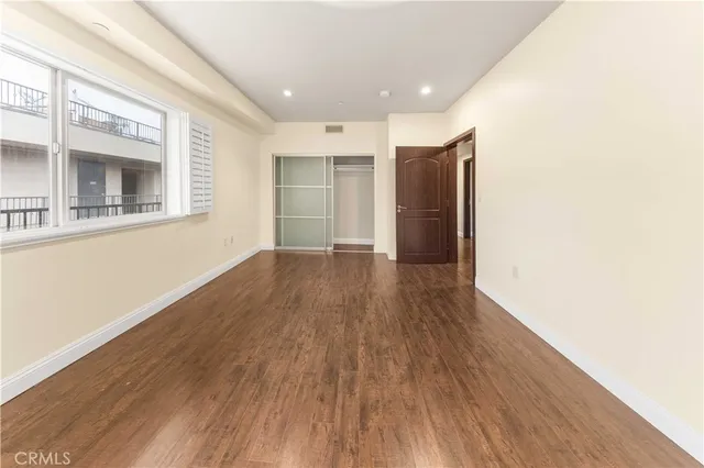 a view of hallway with wooden floor