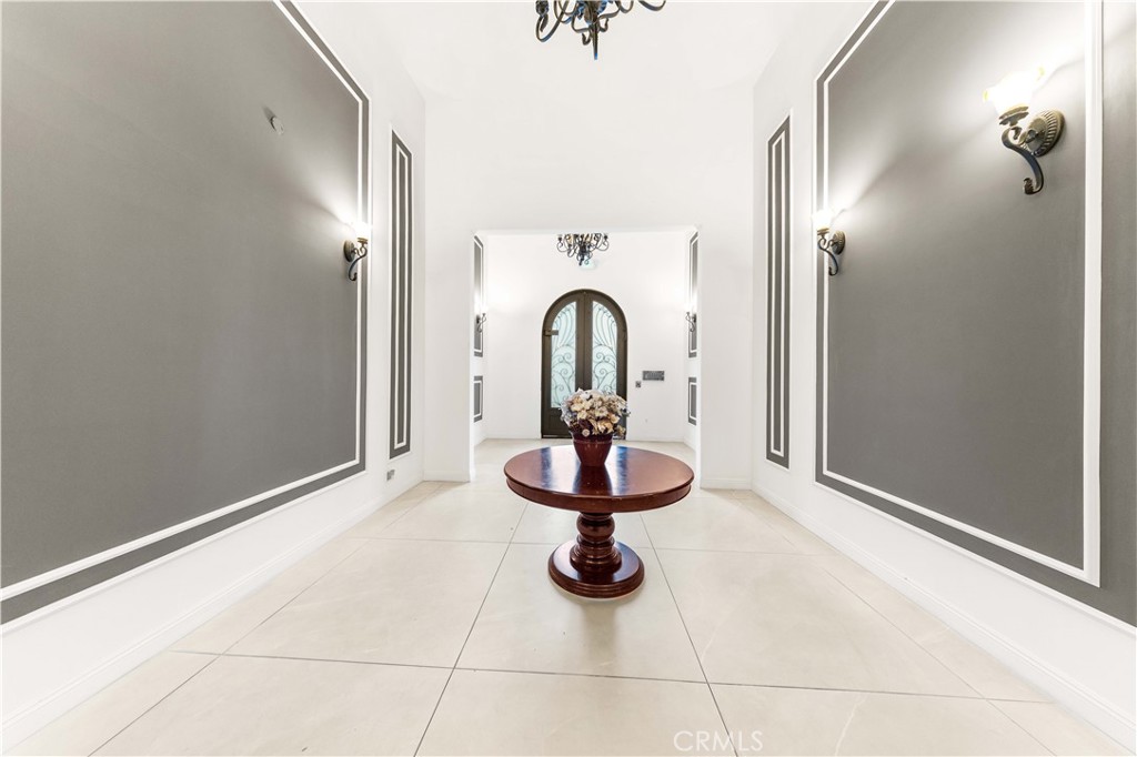 11218 Camarillo Street, Unit 404 Toluca Lake, CA 91602 - Photo 4 of 53 a view of a hallway with a chandelier