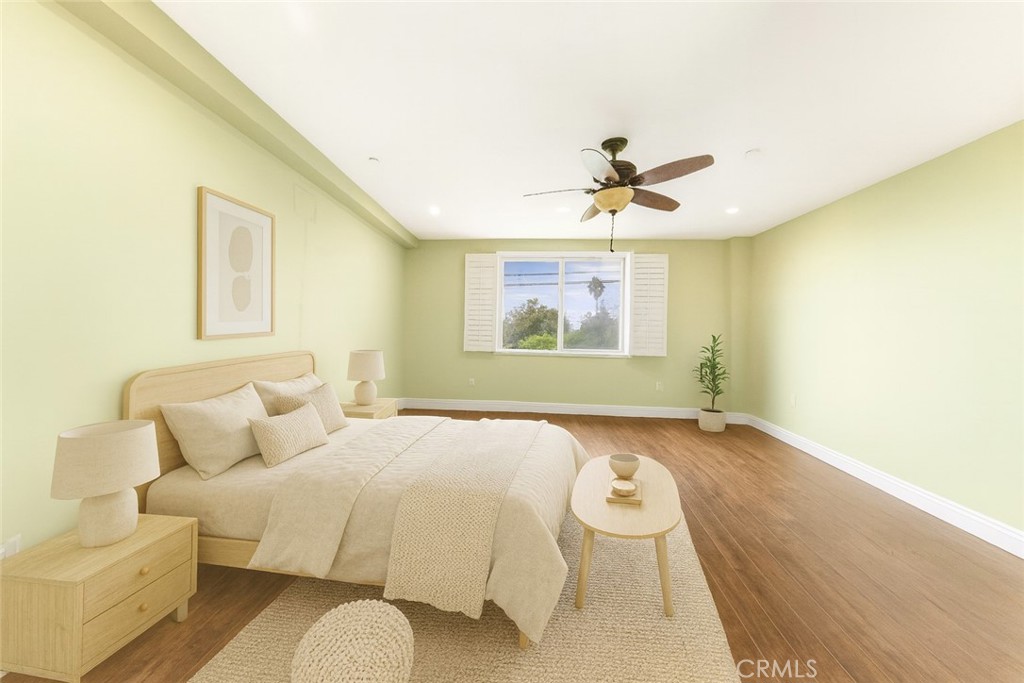 11218 Camarillo Street, Unit 404 Toluca Lake, CA 91602 - Photo 41 of 53 a bedroom with a bed and a chandelier