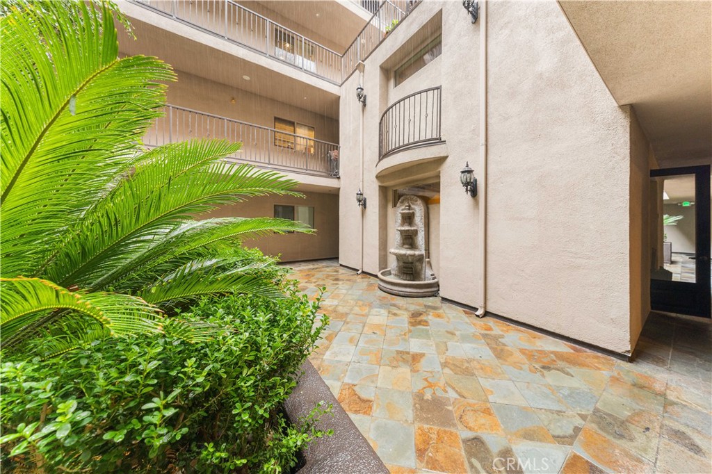 11218 Camarillo Street, Unit 404 Toluca Lake, CA 91602 - Photo 49 of 53 a view of a house with a yard