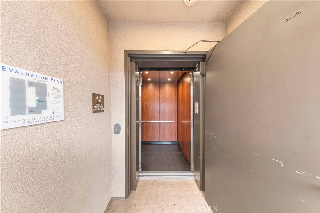 11218 Camarillo Street, Unit 404 Toluca Lake, CA 91602 - Photo 7 of 53 a view of a hallway