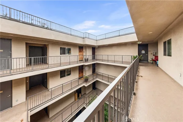 a view of a balcony with furniture