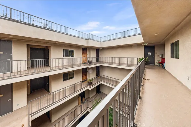 a view of a balcony with furniture