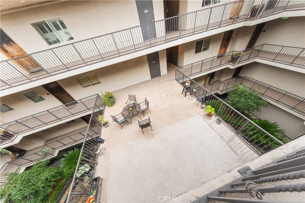 11218 Camarillo Street, Unit 404 Toluca Lake, CA 91602 - Photo 10 of 53 a view of a house with pool