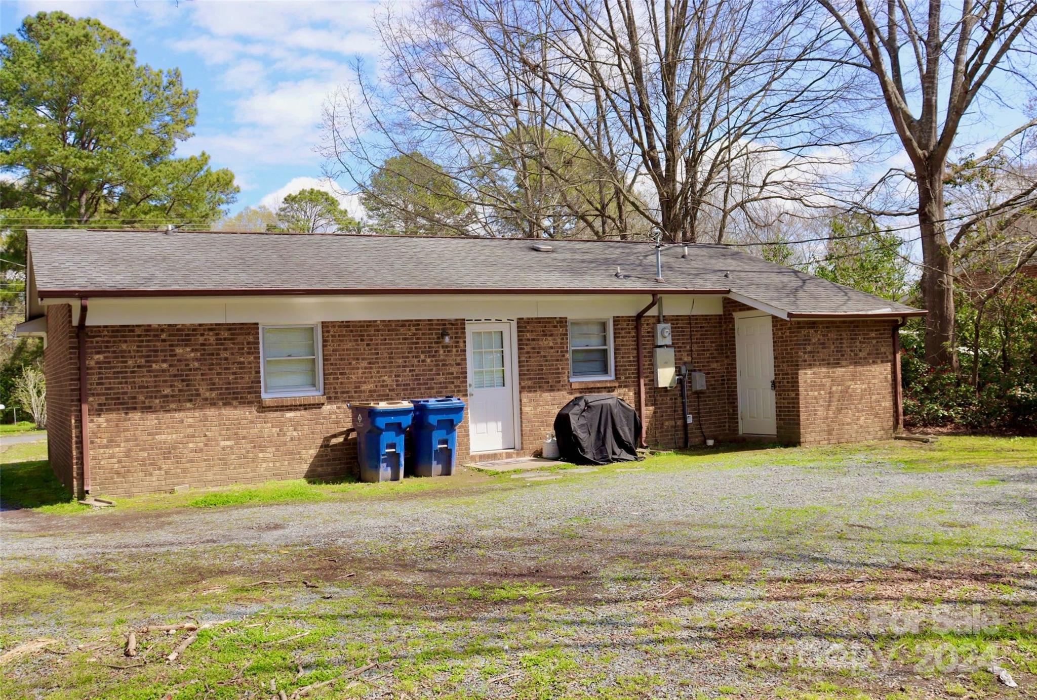 209 Old Williams Road Wingate, NC 28174 - Photo 3 of 13 a front view of a house with a yard and garage