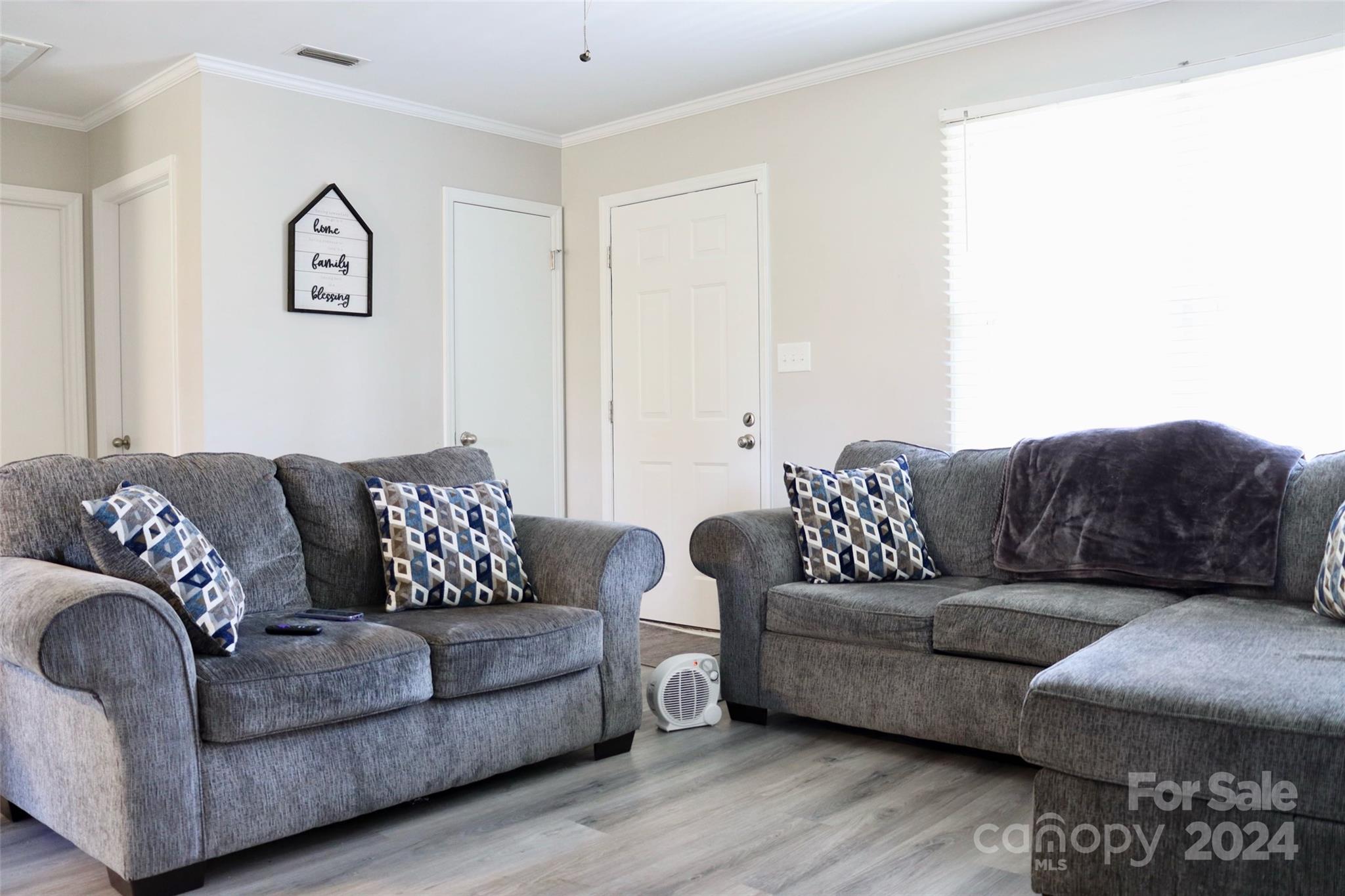 209 Old Williams Road Wingate, NC 28174 - Photo 6 of 13 a living room with couches and a night stand