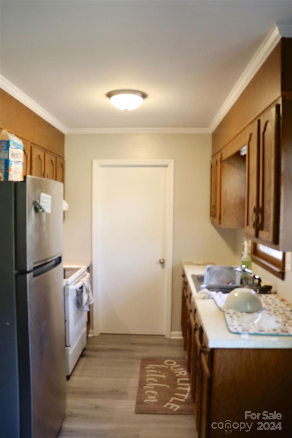 209 Old Williams Road Wingate, NC 28174 - Photo 8 of 13 a kitchen with a sink refrigerator and microwave