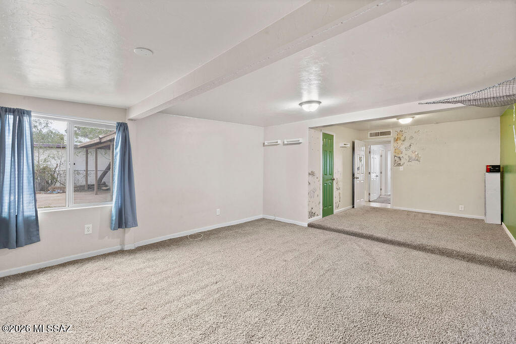 1301 West Kleindale Road Tucson, AZ 85705 - Photo 22 of 27 a view of a big room with windows and closet