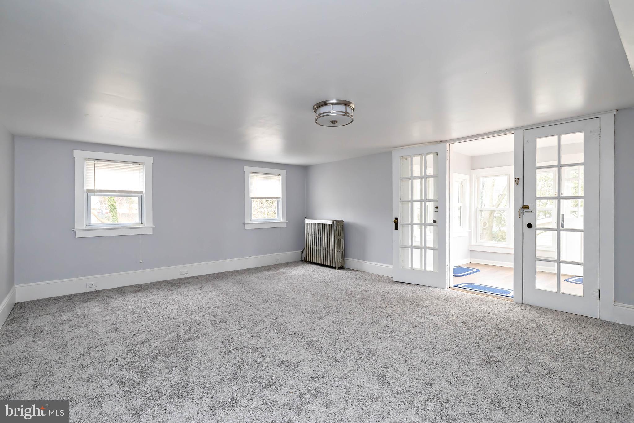 20 East Merchant Street, Unit C Audubon, NJ 08106 - Photo 11 of 26 a view of an empty room with a window