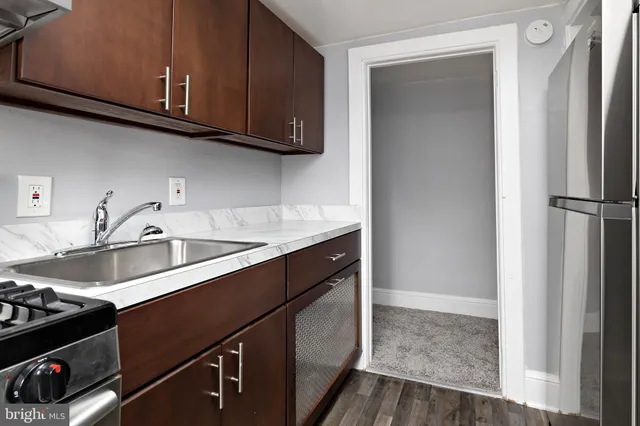 a kitchen with a sink and cabinets