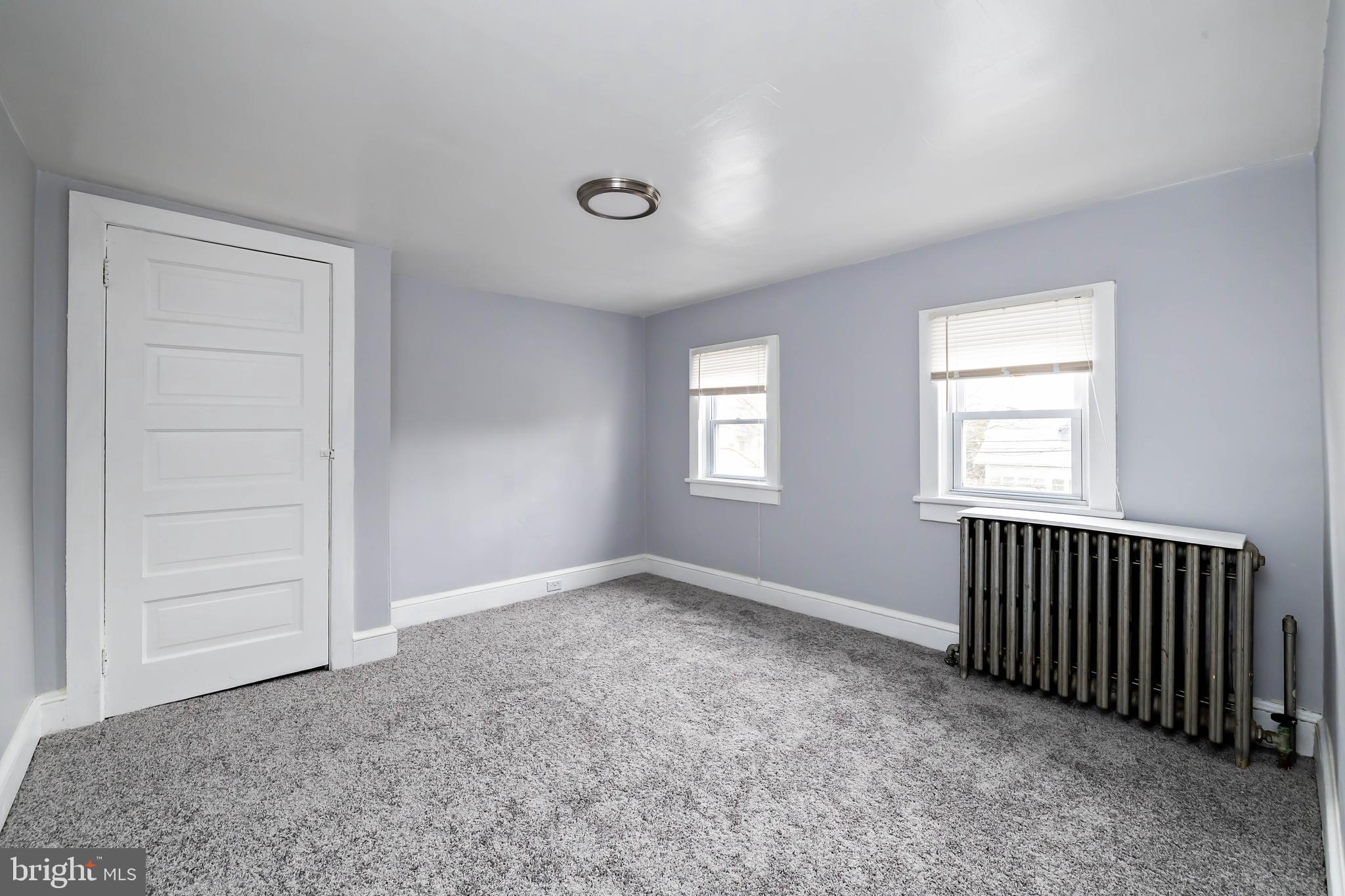 20 East Merchant Street, Unit C Audubon, NJ 08106 - Photo 21 of 26 an empty room with windows