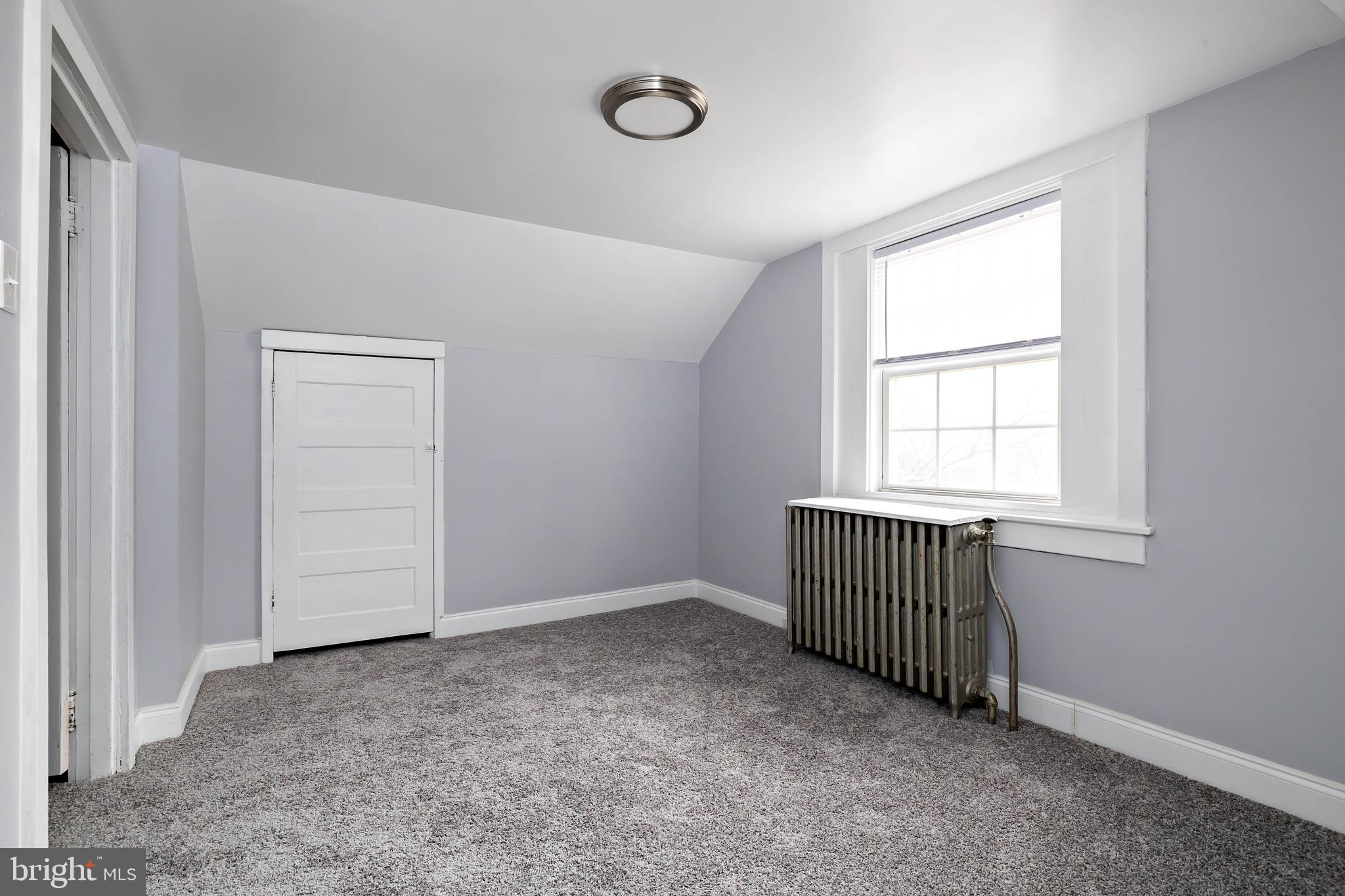 20 East Merchant Street, Unit C Audubon, NJ 08106 - Photo 24 of 26 an empty room with windows