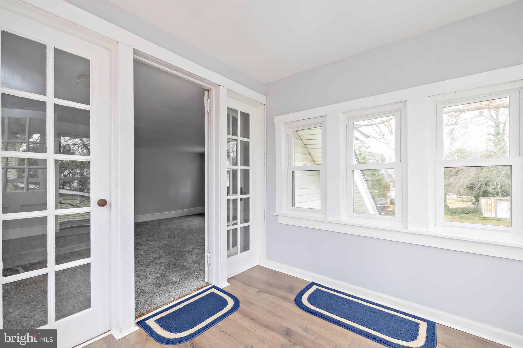 20 East Merchant Street, Unit C Audubon, NJ 08106 - Photo 6 of 26 a view of room with window and wooden floor